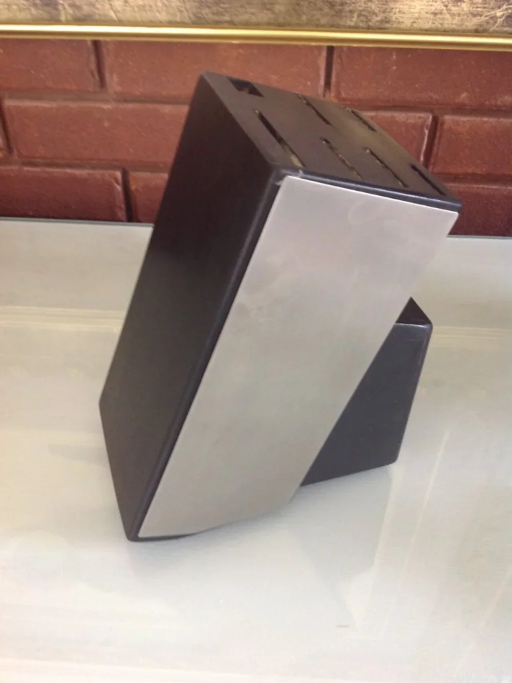 Angled black and silver knife Block